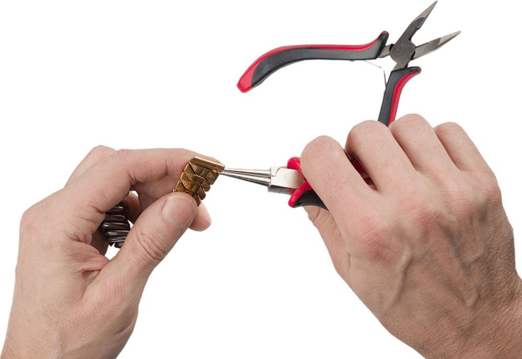 2 hands using pliers to repair a watch band